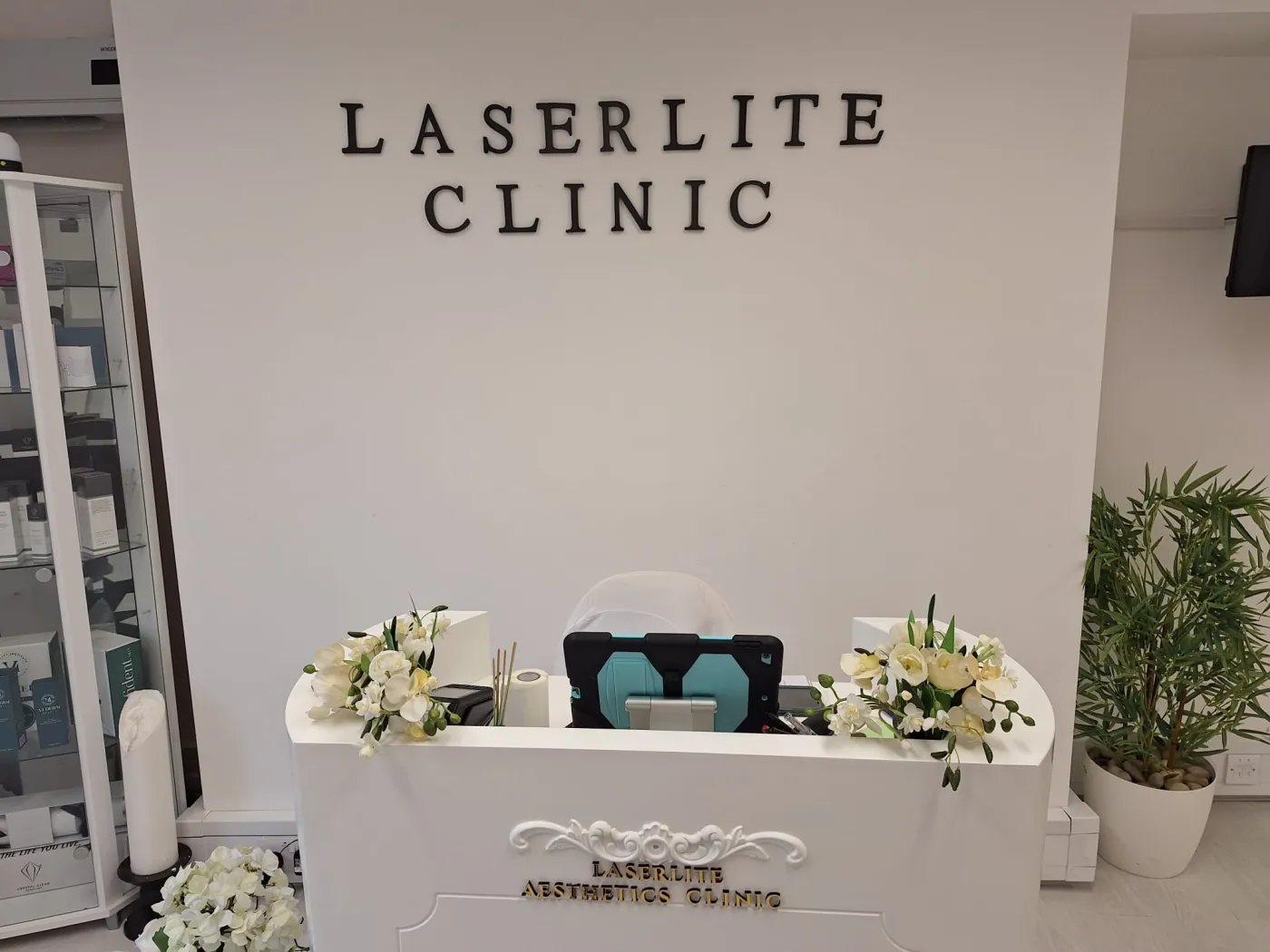The Laserlite Aesthetics Clinic reception desk with fresh flowers The Laserlite Aesthetics Clinic reception desk with fresh flowers